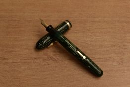 A Conklin lever fill fountain pen in Green vertical stripes with single cap band having Warranted