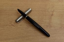 A Parker 51 Aerometric fill fountain pen in Black with lustraloy cap. Circa 1956