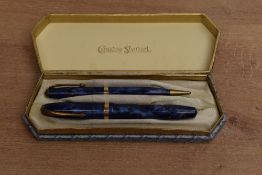 A boxed Conway Stewart No84 lever fill fountain pen and No26 Pencil in Blue Cracked Ice with Gold