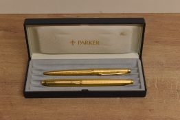 A boxed Parker 75 converter fill fountain pen and ballpoint pen set in Verdome Grain d'Orge gold