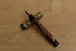 A Parker Duofold Junior button fill fountain pen in Pearl and Black with three bands to a Flat Top