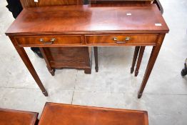 A reproduction mahogany side /hall table having two frieze drawers, dimensions approx. W100 D33