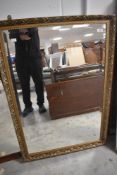 A modern gilt frame wall mirror, approx 100 x 69cm