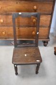 A Georgian oak childs chair having open back, solid seat and turned legs, seat height approx.
