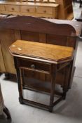 A vintage oak low hall tablenof canted form with frieze drawer, width approx. 65cm