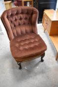 A vintage dralon button back nursing chair