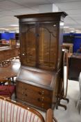 An early 20th Century oak bureau bookcase