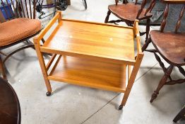 A vintage teak tea trolley