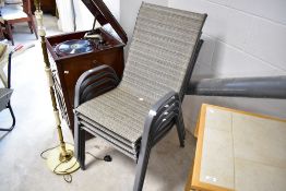 A set of four modern garden chairs