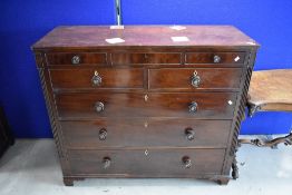 A 19th Century mahogany chest of three shallow over two short and three long drawers having turned