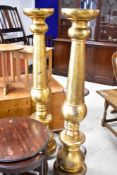 A pair of oversized gilt finished torchere stands, height approx. 153cm