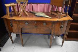 A 19th Century Regency mahogany sideboard having brass rail to back with later pink velvet