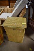 A vintage Lloyd Loom bedside or laundry cabinet having front opening , dimensions approx. H71 W47