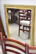 A vintage gilt framed wall mirror, approx. 106 x 76cm