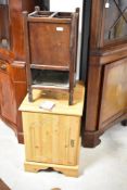 A laminate pine effect bedside cupboard, ply stick stand and gilt frame wall mirror