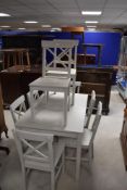 A modern grey painted kitchen/dining table of rectangular form and eight similar chairs, table