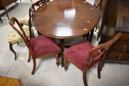 A set of four Victorian mahogany balloon back dining chairs