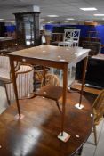 An Edwardian mahogany occasional table of square form having inlaid detailing and square undertier