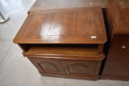 A vintage wooden and brass inlayed TV cabinet and similar side cabinet