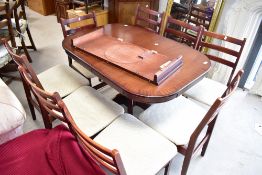 A reproduction Regency pedestal table and set of eight vintage ladder back dining chairs