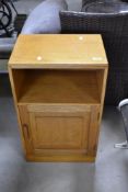 An Arts & Crafts design golden oak bedside cabinet, in the style of A W Simpson Handicrafts (not