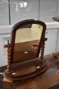 A Victorian mahogany toilet mirror having turned supports, width approx. 53cm