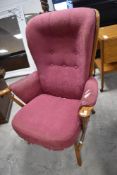A vintage cottage style armchair, possibly Ercol