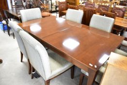 A modern mahogany designer table, being approx. 112 x 200, plus two additional leaves of approx 50cm