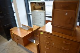 An early G Plan (Gomme) golden oak bedroom suite comprising headboard, dressing table, chest of