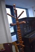 A reproduction hatstand having twist column