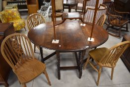 A set of four traditional wheelback kitchen dining chairs