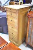 A modern narrow chest of six drawers (ex Stollers), dimensions approx. H136 W59 D51cm