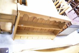 A modern natural pine wall rack, width approx. 122cm