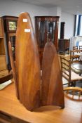 A novelty fire screen constructed from vintage wooden plane propellors