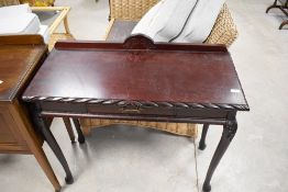A reproduction mahogany effect hall table, dimensions approx. width 91 depth 41 height 75cm (plus