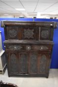 A period oak court cupboard of typical design with foliate carving throughout, dimensions approx.