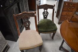 A set of four Victorian mahogany dining chairs having overstuffed seats