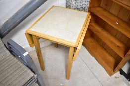 S modern drop leaf breakfast table having tile top and wood frame, closed approx. dimensions 55 x