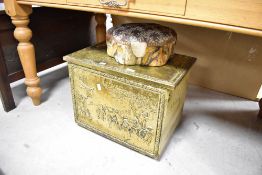 A traditional brass slipper box and upholstered foot rest
