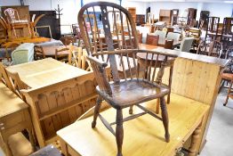 A 19th Century ash Windsor armchair of typical form with spindle back and H stretcher