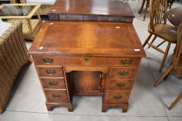 A nice quality reproduction kneehole desk, dimensions approx. Width 79 Depth 48 Height 74cm