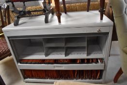 A metal office hanging file cabinet