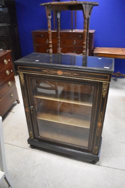 A Victorian ebonised pier cabinet having inlaid decoration and brass/ormolu mounts, dimensions.