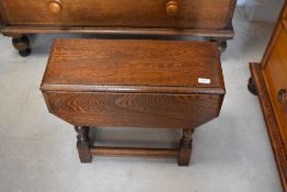 A traditional oak drop leaf occasional table, width approx 58cm, height 45cm