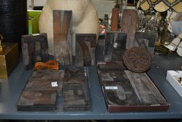 A selection of early to mid 20th-century Industrial-style wooden letter printing blocks, to
