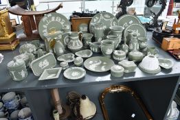 A large selection of 20th-century Wedgwood green jasperware, featuring a selection of relief moulded