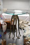 An unusual contemporary decorative accent table, featuring a gilt-finish metal octopus base with a