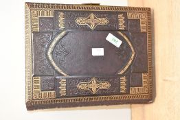 A fine Victorian leather bound musical photo album, featuring ornate embossed detailing with gilt