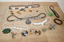 A small assortment of costume jewellery, including a citrine and tiger's-eye necklace, a faceted
