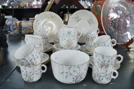 An early 20th-century ceramic part tea service, featuring delicate blue and gilt floral details upon